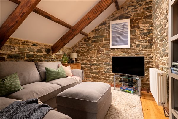 Large sofa in the snug for movie nights