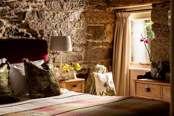 Bedroom and window in a luxury cottage for couples