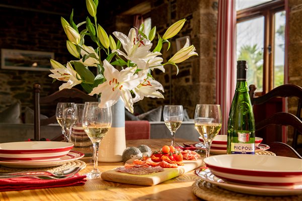 Laid dining table in a luxury farm holiday cottage