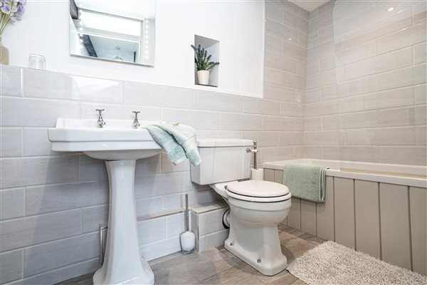 Bathroom with shower over the bath