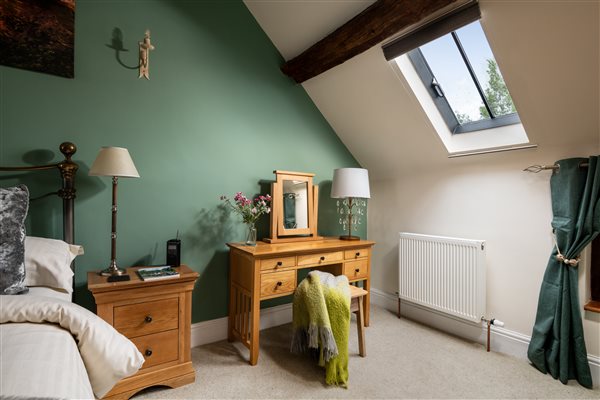 dressing table next to king size bed