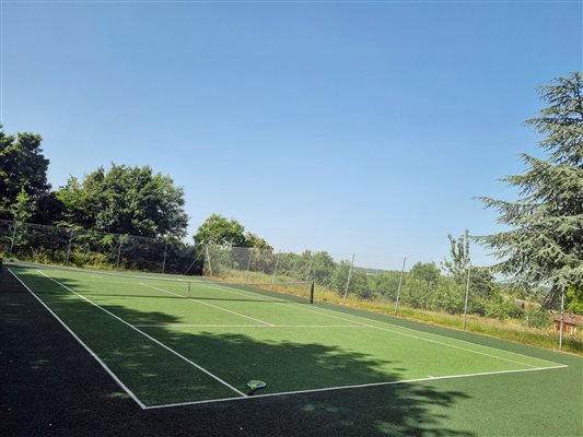 tennis court with clear blue sky