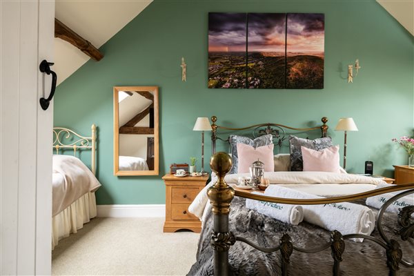 King size bed and mattress made up with quality linen to provide a great nights sleep