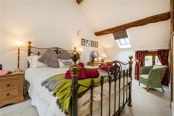 Master bedroom with very comfortable king size bed and extra single