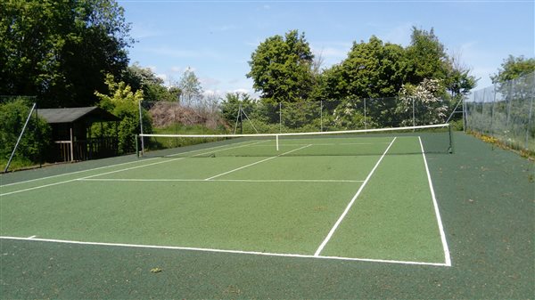 Outdoor tennis court on site