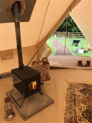 Cosy bell tent with wood burner