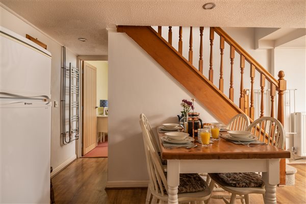 Stairs, table, ground floor bedroom