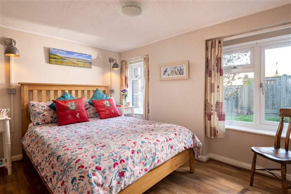 Double bedroom with oak framed bed