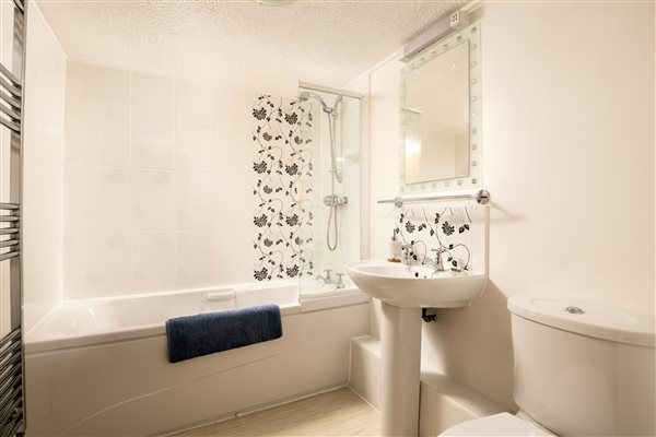 bathroom with Laura Ashley tiling