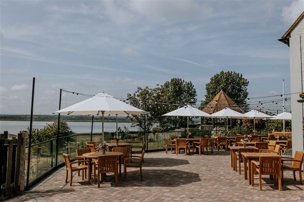 The waterside dining terrace at The Ferry House award-winning restaurant in Kent. 