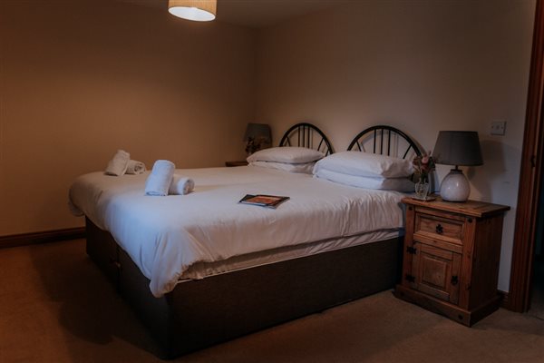A bedroom in one of the cottages at Mocketts Farm self-catering cottages in Kent.