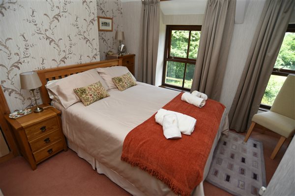 bedroom overlooks the garden at Llwyn Beuno -llynholidays.wales