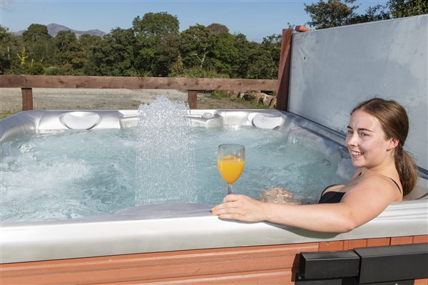 Relax in the hottub at Llwyn Beuno Holiday Cottage on Llyn Peninsula