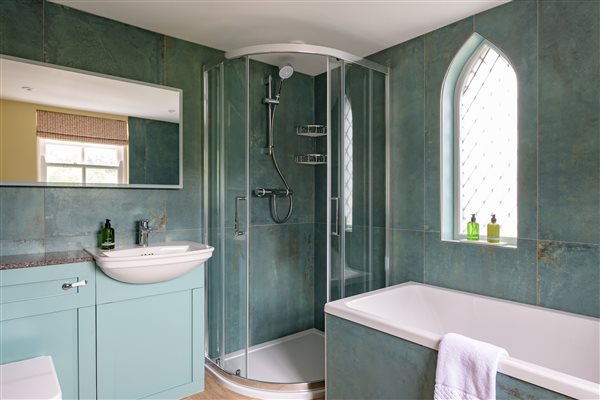 Bathroom in the turret with feature gothic window - used by bedroom 4