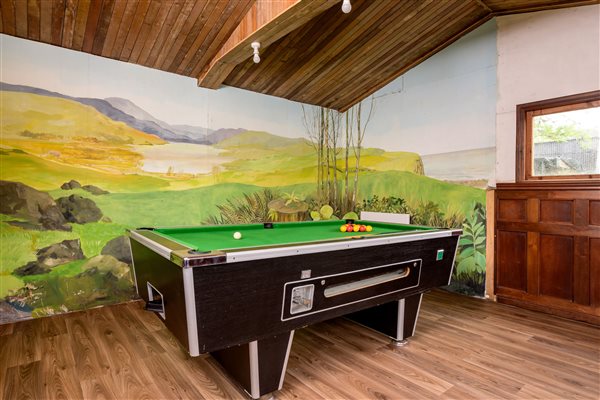 Play pool in the games room, located in an adjacent building