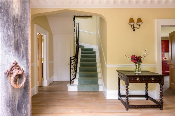 Entrance hallway through the gothic oak front door and stairs