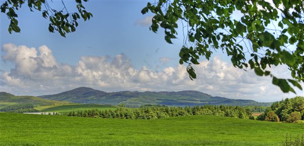 Orroland panorama with hills and grass fields