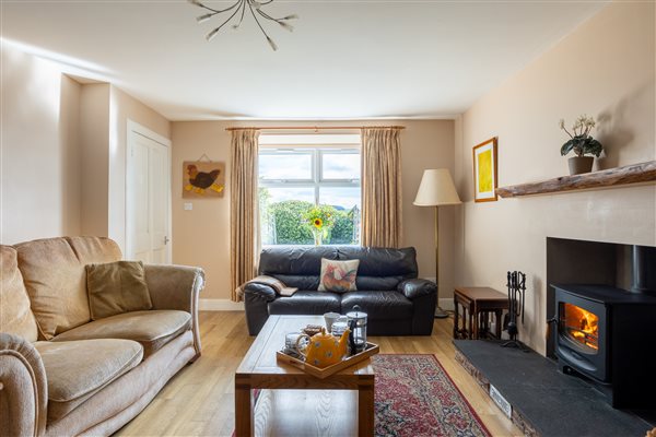 Owl Cottage Sitting Room with wood burner stove