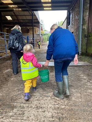 Lucy giving a helping hand to a little guest