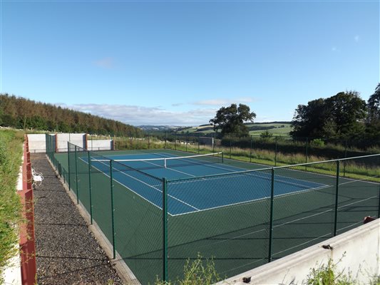 Anyone for tennis? Bring your rackets and trainers to use the court