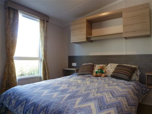 Spacious main bedroom in Caravan 3