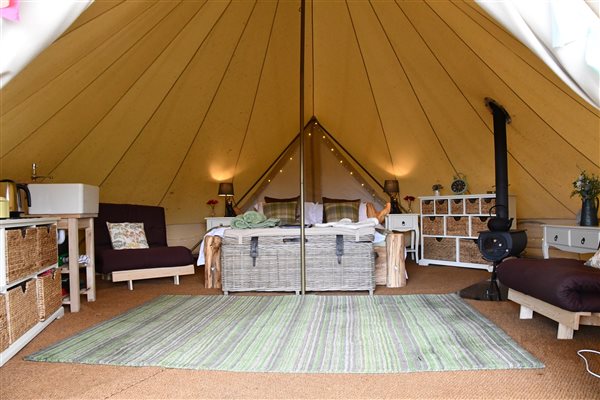 Inside our cosy bell tents