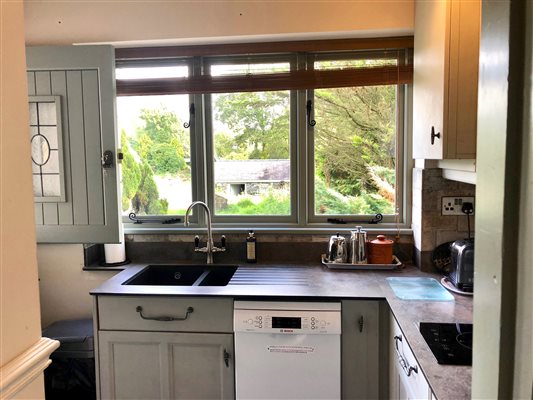 compact kitchen at Y Stabal Suite number 2 at Snowdonia Holidays Tyddyn Du Farm Eryri, dog friendly accommodation close to Snowdon, Zip World, beaches, mountain hikes and best mountain biking in Wales. UK