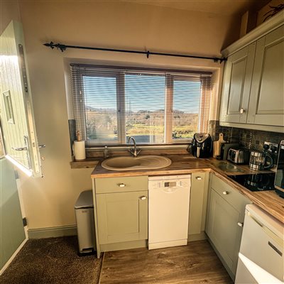 compact kitchen with all amenities in Beudy 3 including air fryer. countryside eryri snowdonia views, cosy cottage accommodation in eryri snowdonia north wales, dog friendly ideal for couples and families.