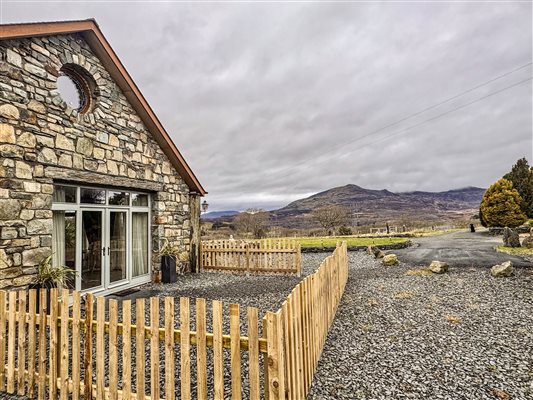 Enclosed area outside Ty Gwair 6. Luxury Barn converted suite at Snowdonia Holidays Tyddyn Du Farm Eryri
