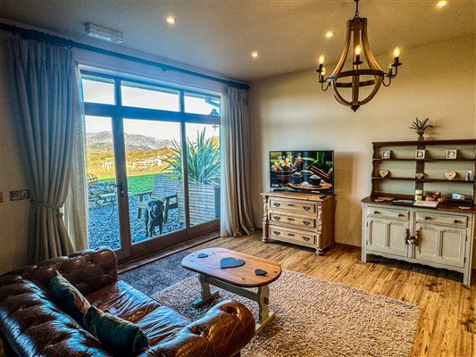 Beautiful Mountain Views from your own lounge at Ty Gwair 5 - Hay barn conversion in the heart of Eryri (Snowdonia) National Park. Farm retreat with friendly farm animals, perfect couples retreat in North Wales close to mountain biking trails, hikes, coastal paths and all attractions.