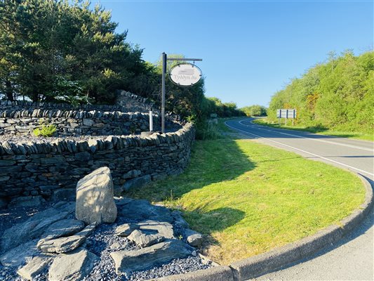 Farm entrance atcosy cottages in Wales at Snowdonia Holidays Tyddyn du Farm. Farm stays in Snowdonia National Park. Dog friendly accommodation close to Snowdon, Zip World Wales best beaches and mountain hikes. Close to Coed y Brenin Forest best mountain bike trails in the UK