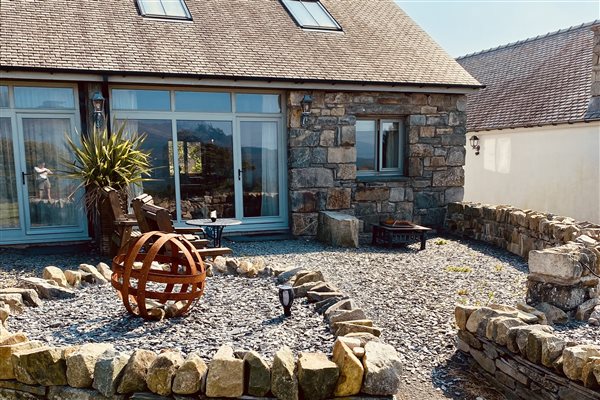Patio area outside Ty Gwair 5 - Luxury barn converted suite, ideal for a romantic getaway in Eryri North Wales.