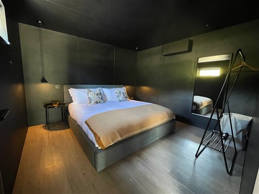 The master bedroom features a handmade Naturalmat superking bed.
