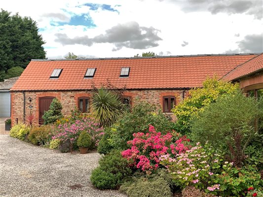 brick cottage with tile roof