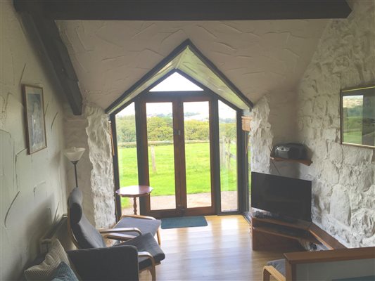 Chapel Barn. Sit and enjoy the view over fields and woodland.
