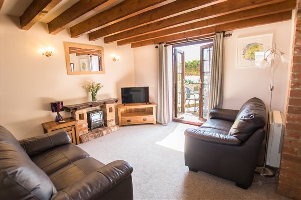 owl hayes living room with french doors to patio