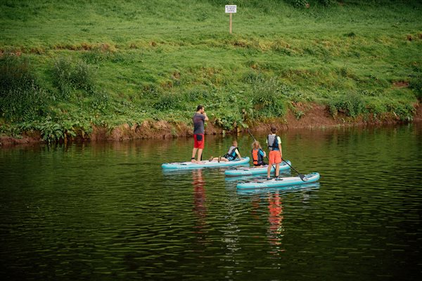 Glamping on river wye stand up paddleboarding family