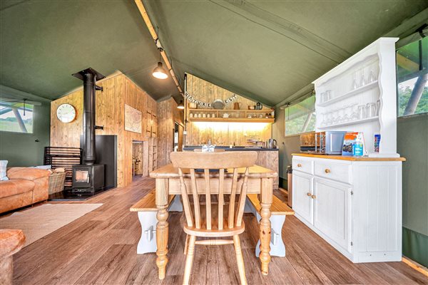 Herefordshire glamping safari tent inside, dining table, wood burner