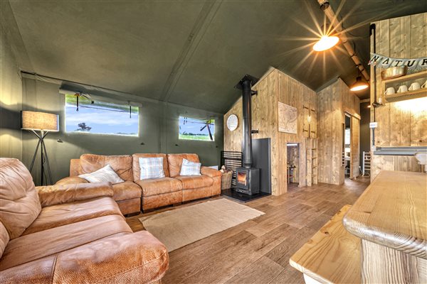 Herefordshire glamping safari tent living area with wood burner