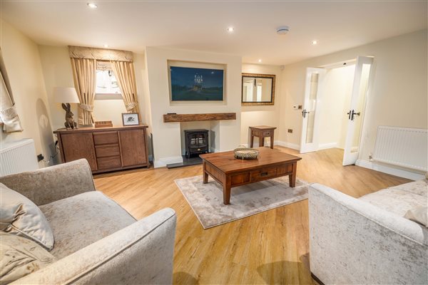 Lounge with electric log burner and TV Lounge with electric log burner and TV