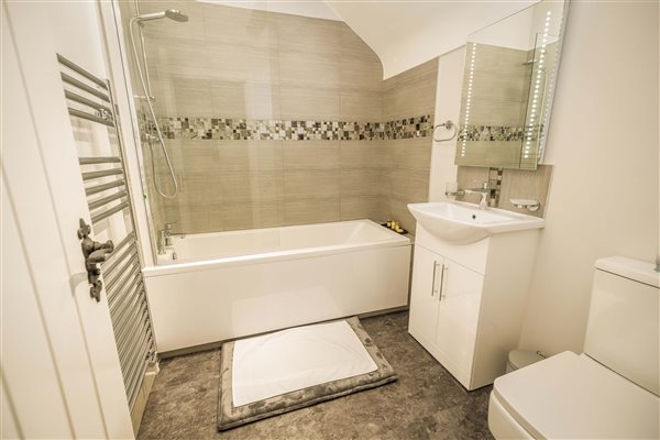 Ensuite with bath and overhead shower Ensuite with bath and overhead shower